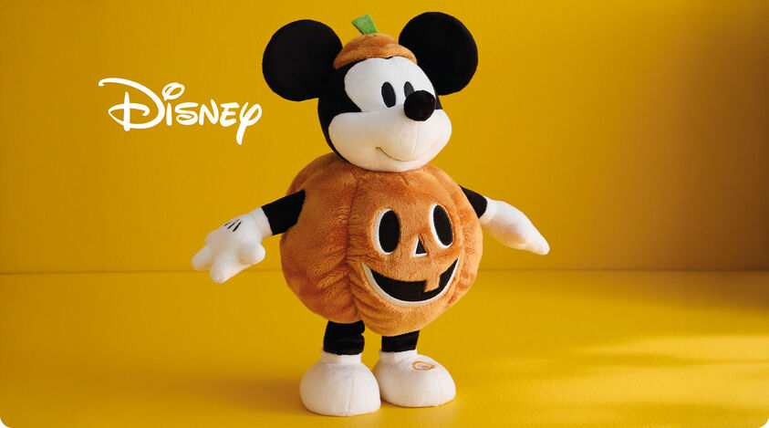 Plush vintage Mickey in a pumpkin costume.